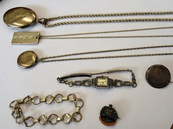 Mostly silver jewellery, comprising; an oval pendant locket, with a ropetwist link neckchain, a circular pendant locket, with a neckchain, a rectangul