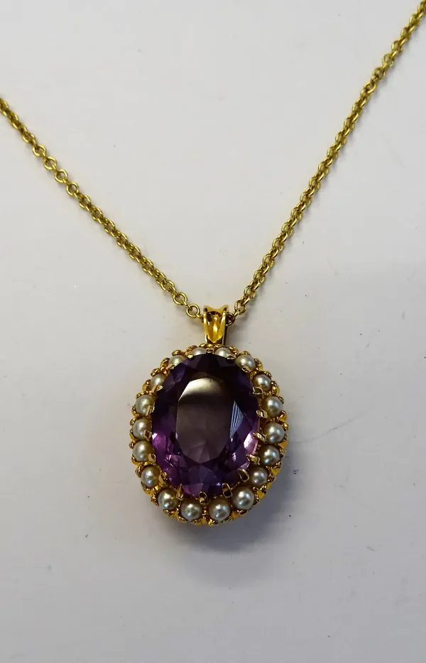 A gold, amethyst and cultured pearl pendant, claw set with the oval cut amethyst within a surround of cultured pearls, with an 18ct gold circular link