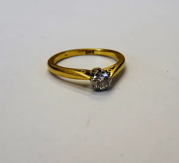 A gold and diamond single stone ring, claw set with a circular cut diamond, detailed 18 CT, ring size L and a half, gross weight 2.5 gms.