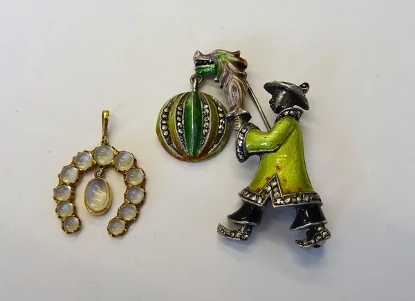 A sterling silver, marcasite set and enamelled brooch, designed as the standing figure of a Chinaman holding a lantern, detailed STERLING and a moonst