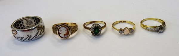 A gold and platinum, opal and diamond set three stone ring, an 18ct gold and diamond ring (two diamonds lacking), a 9ct gold and oval shell cameo ring