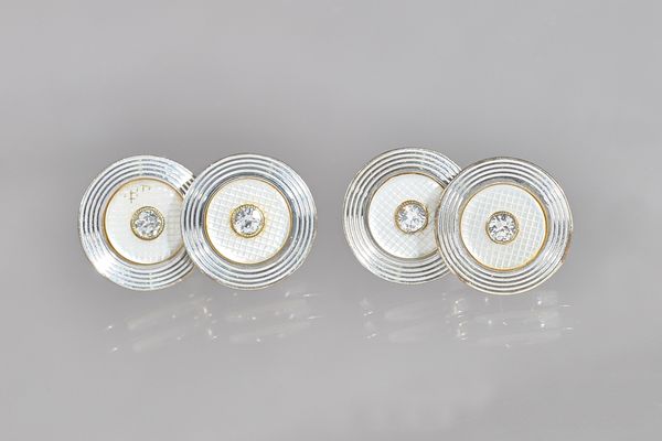 A pair of 9ct white gold, diamond set and mother-of-pearl cufflinks, each back and front of circular form, mounted with a circular cut diamond to the