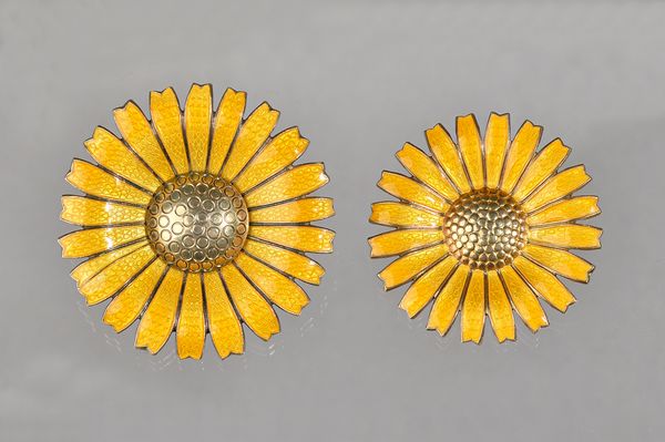 A Georg Jensen silver gilt and yellow enamelled brooch, designed as a flowerhead, detailed A M Sterling Denmark, import mark London 1978, diameter 5cm