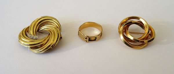 A 9ct gold brooch, in an inter-looped design, another gold and diamond set brooch, in an inter-looped design and a Victorian gold ring, in a buckle an