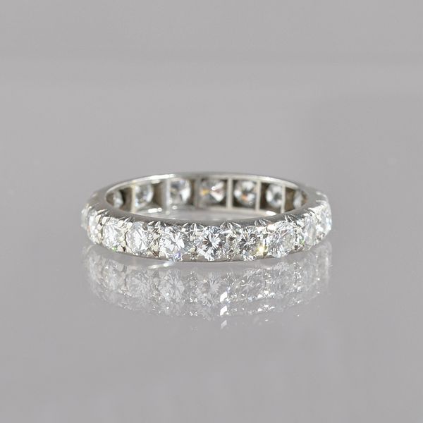 A diamond set full eternity ring, mounted with circular cut diamonds with slight variation of cut, ring size O, gross weight 3.9 gms. Illustrated.