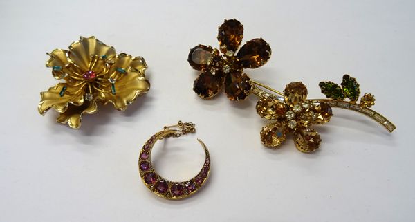 A gold, diamond and pink gem set brooch, designed as a crescent (the brooch pin lacking), fitted with a safety chain and two gilt metal and vary colou