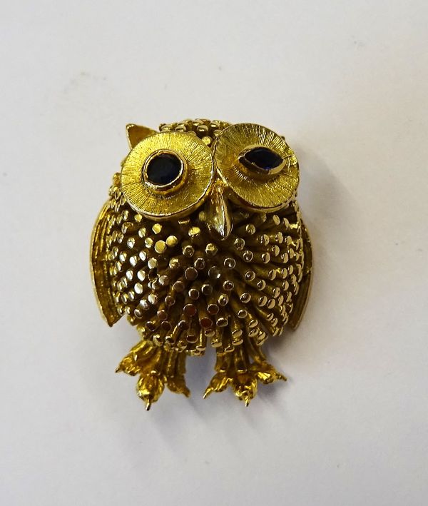 A 9ct gold brooch, designed as a winking owl, having sapphire set eyes, London 1967, gross weight 13 gms.