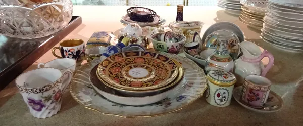 A group of English and Continental ceramics and enamels, to include; miniature cups and saucers; a Staffordshire dog whistle; a Berlin porcelain plate