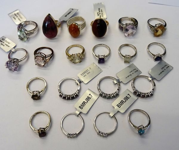 A collection of twenty silver and silver gilt, gem set rings, in a variety of designs. (20)