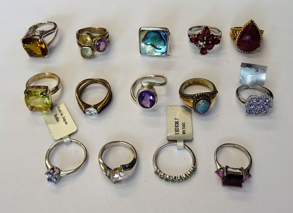 A collection of fourteen silver and silver gilt, gem set rings, in a variety of designs. (14)