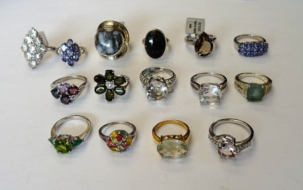 A collection of fifteen silver and silver gilt, gem set rings, in a variety of designs. (15)