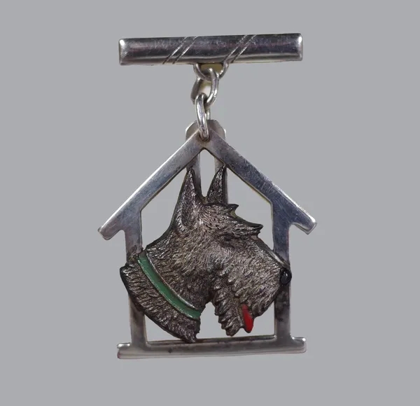 Scottish Terrier interest; a novelty badge, profile study of a Scottie with painted tongue and collar, kennel shaped frame and sterling silver suspens