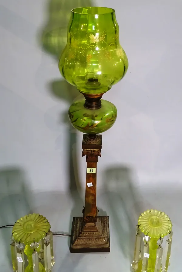 A late Victorian oil lamp converted to a table lamp with green glass shade and a pair of green coloured glass candlesticks, (3).