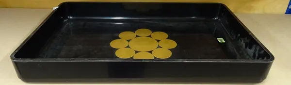 A large 20th century lacquered black tray with central gold floral motif.