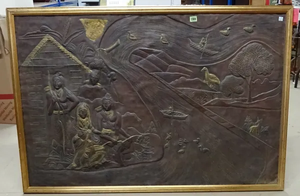 A modern bronzed panel depicting Egyptian scene of figures by water.