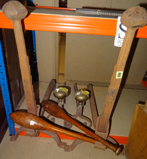 A pair of 19th century wrought iron andirons, 76cm high , another smaller pair, a pair of early 20th century stained beech juggling batons, a glass te