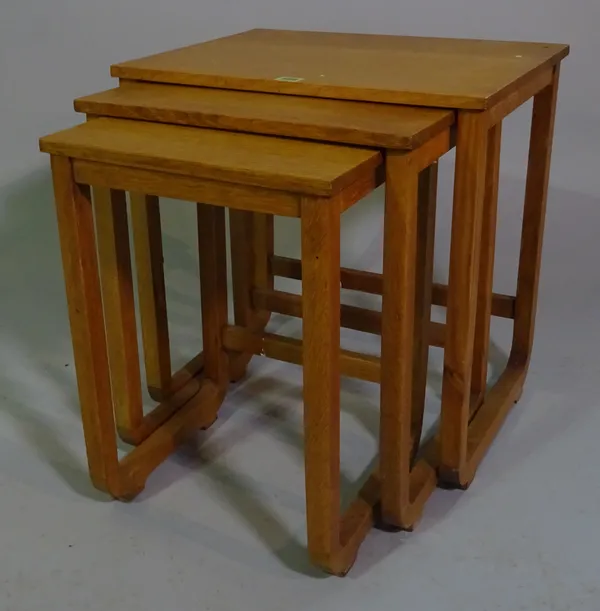 A 20th century oak nest of three tables, the largest 50cm wide x 53cm high.