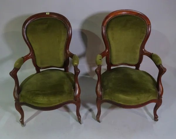 A pair of Victorian mahogany spoonback open armchairs, (2).