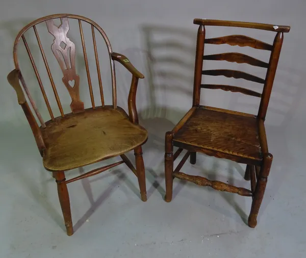 A 19th century ash and elm Windsor chair and an early 19th century ash ladder back chair (2).