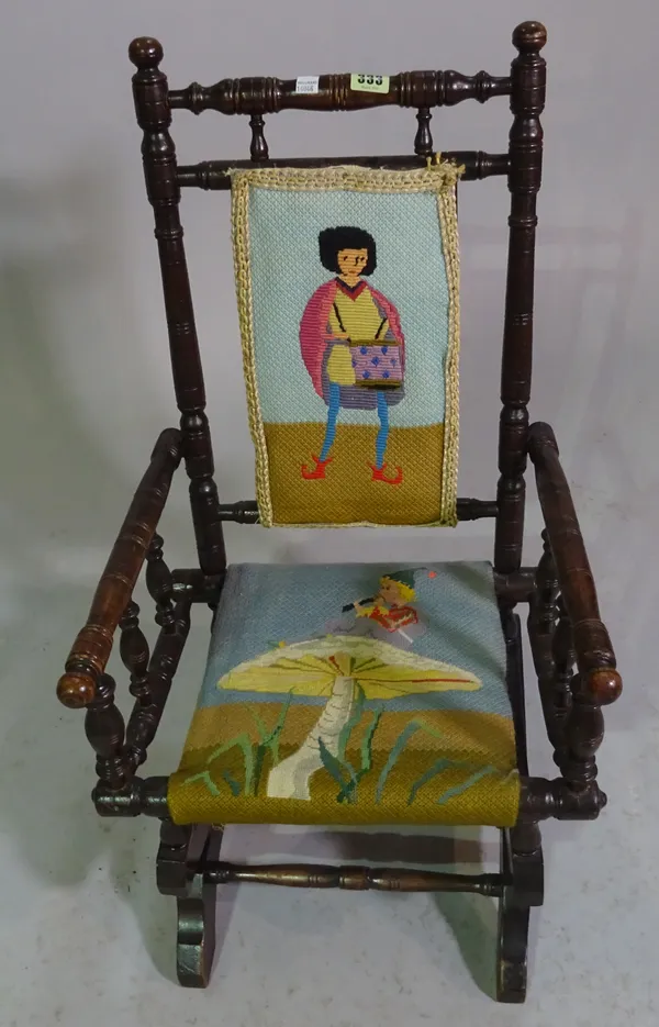 A 19th century mahogany American child's rocking open armchair.