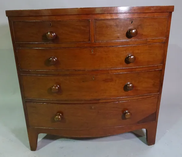 A 19th century mahogany bowfront chest of two short and three long drawers on splayed bracket feet, 101cm wide x 104cm high.