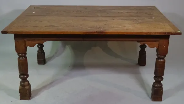 An 18th century style oak plank top dining table, 152cm long x 72cm wide.