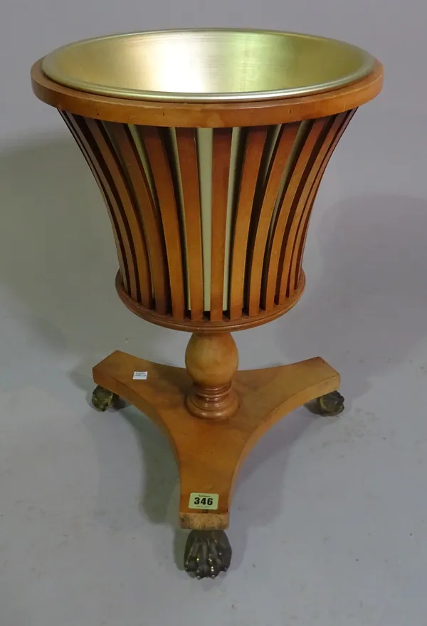 A Dutch mahogany jardinière with open slatted body on three gilt metal lion paw feet, 52cm high.