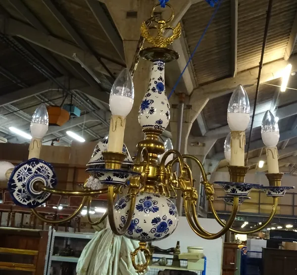 A Dutch style brass and blue and white ceramic eight light chandelier, 70cm wide.