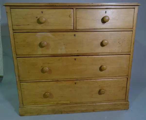 A large Victorian pine chest of two short and three long graduated drawers on plinth base, 117cm wide x 109cm high.