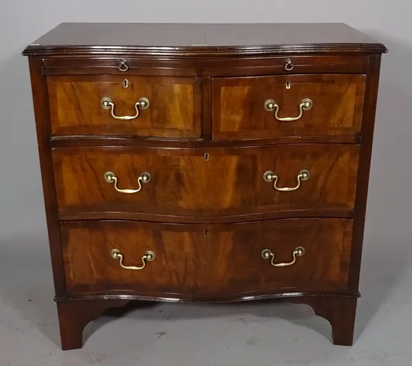 A George III style serpentine chest, with brushing slide over two short and two long drawers on bracket feet, 78cm wide x 76cm high.