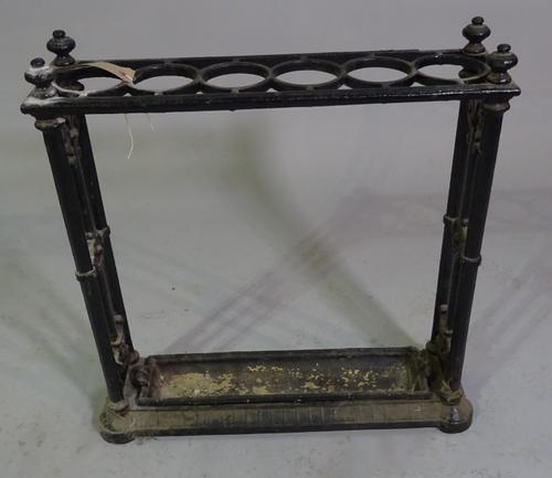 An early 20th century cast iron six division stick stand, 60cm wide x 64cm high.