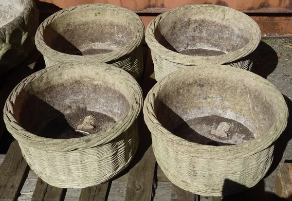 A group of four 20th century reconstituted stone circular plant pots of wicker form, 42cm wide x 23cm high, (4).