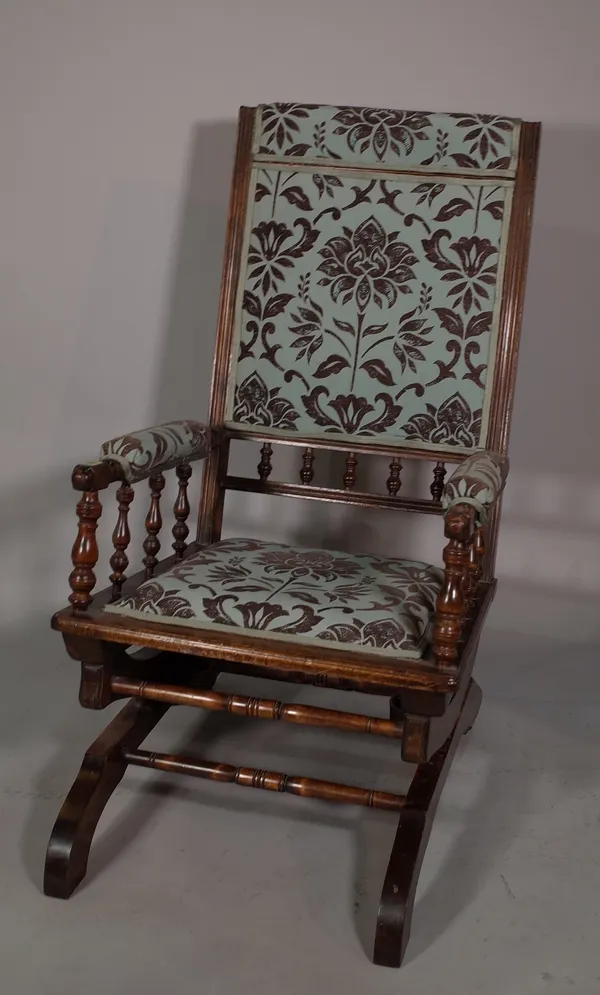 A late 19th century mahogany America rocking armchair.