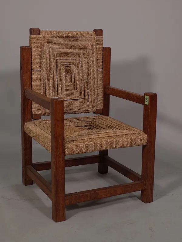 A 20th century oak framed child's green armchair with reversible back on square supports, 39cm wide x 65cm high.