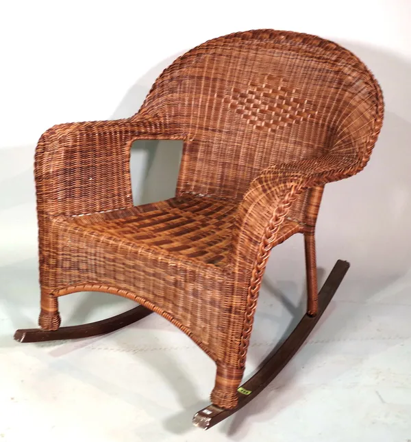 A 20th century simulated wicker rocking armchair.