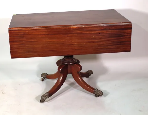 A 19th century mahogany drop flap centre table on four outswept supports, 130cm wide.