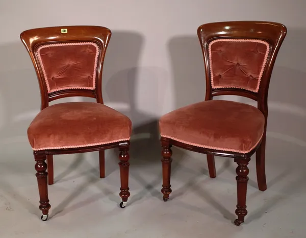 A set of six 19th century mahogany button upholstered dining chairs on turned supports, (6).