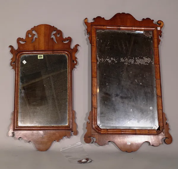 A George III mahogany fret cut pier mirror, 50cm wide x 80cm high, and another smaller walnut fret cut pier mirror, 45cm wide x 76cm high, (a.f.) (2).