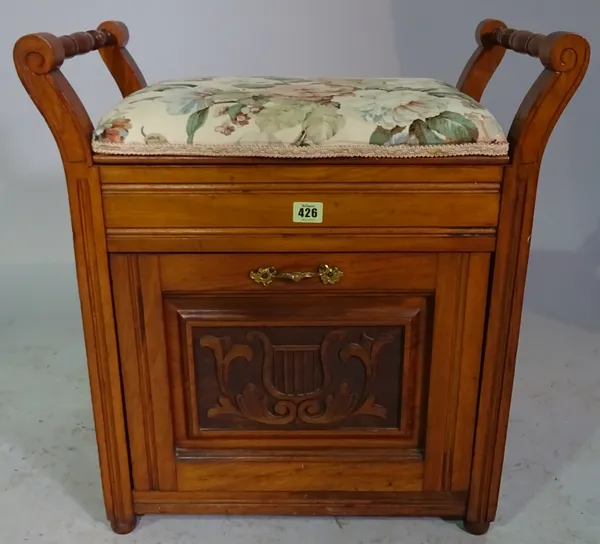 A mahogany piano stool with pull out drawer together with a gout stool, (2).