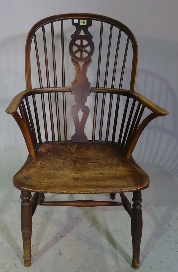 A 19th century ash and elm wheelback armchair, 98cm high.