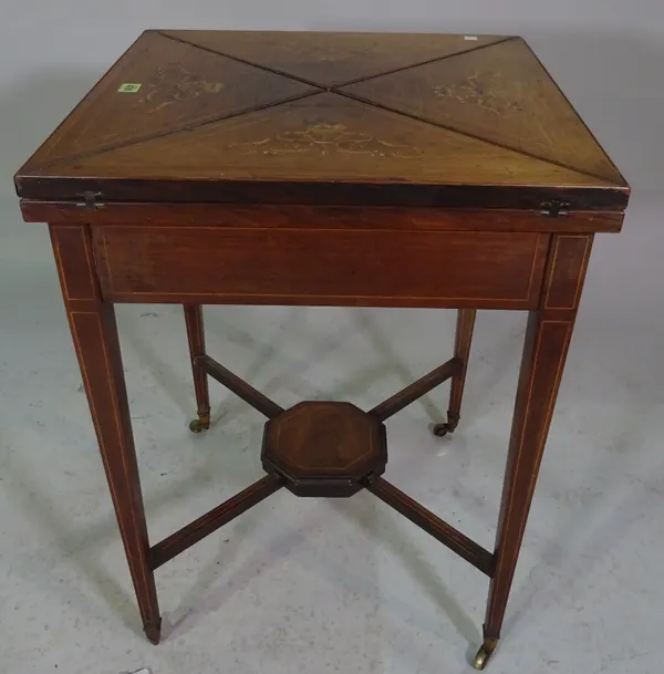 An Edwardian rosewood and inlaid envelope card table on tapering supports, 56cm wide x 76cm high.