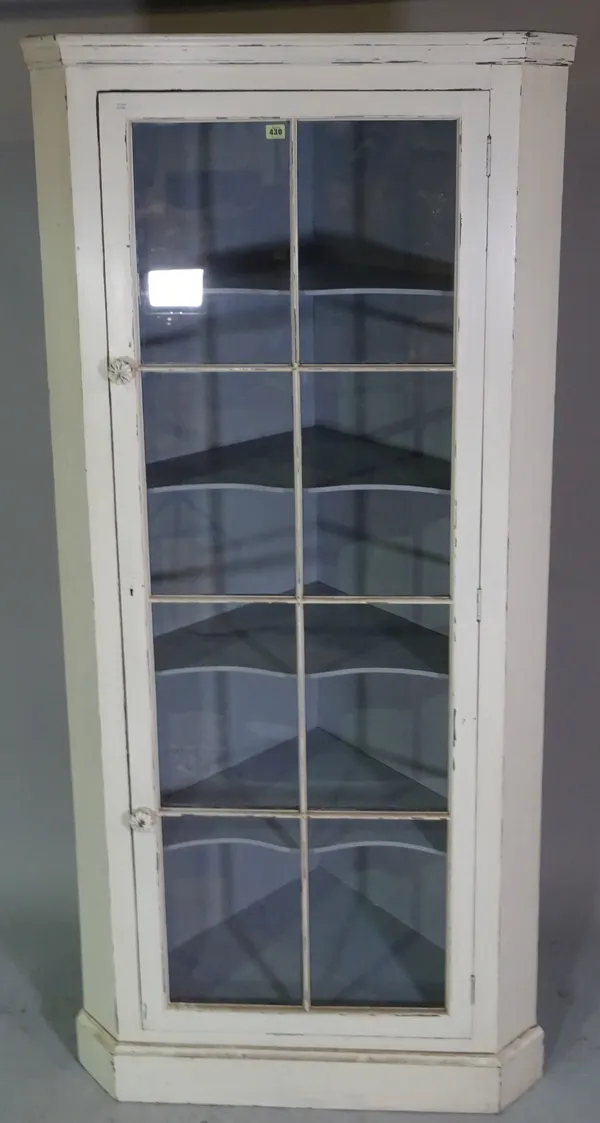 A white painted corner display cabinet with single glazed door, 89cm wide x 205cm high.