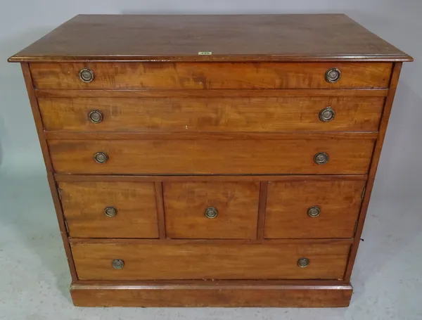 A George III mahogany lift top washstand, fronted with an arrangement of drawers and cupboards, 95cm wide x 86cm high.