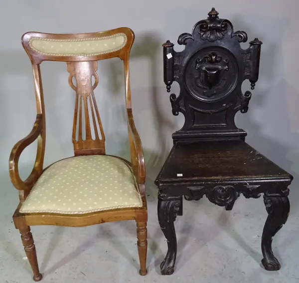 An Edwardian inlaid mahogany tub back chair, 47cm wide x 89cm high, together with a Victorian carved oak hall chair, 49cm wide x 96cm high, (2).