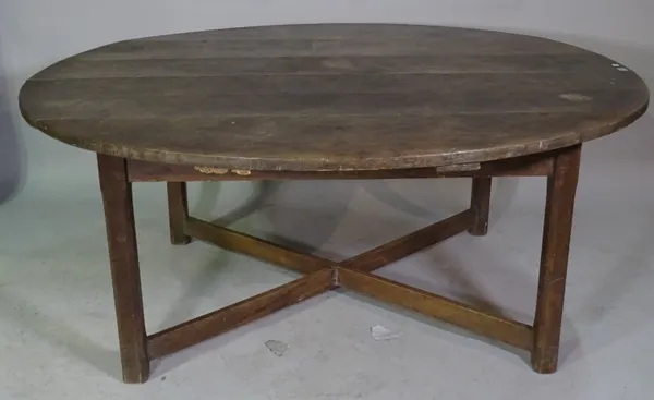 A early 20th century oak circular dining table on 'X' frame base, 168cm wide 60cm high.