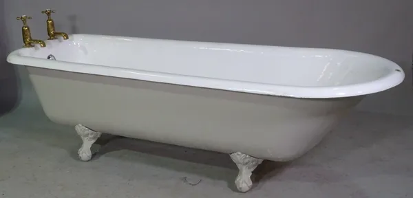 A Victorian white enamelled cast iron bath on ball and claw feet, 180cm long x 55cm high.