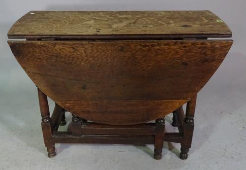 A 17th century and later oak gateleg table with single drawer, 92cm long x 69cm high.