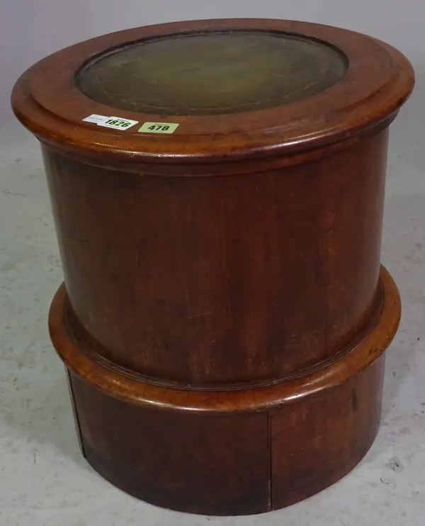 A Victorian mahogany circular lift top commode with integral foot rest, 45cm diameter x 45cm high.