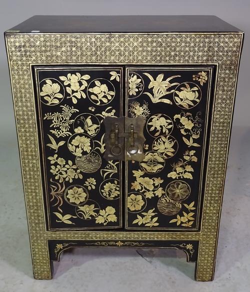 An early 20th century Chinese export chinoiserie decorated small two door side cabinet, 60cm wide x 82cm high.