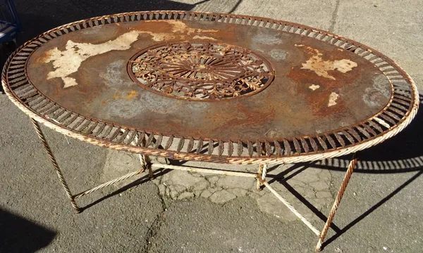 A 20th century French white painted metal oval garden table on spiral twisted supports, 160cm long x 77cm high.